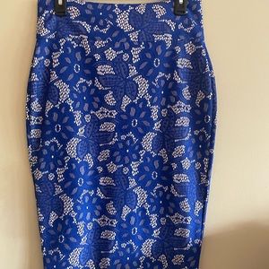 Cobalt blue and tan lace design knee length skirt. Size Medium.